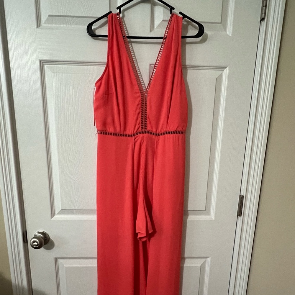 Boutique high-low romper in coral pink. Size 4.